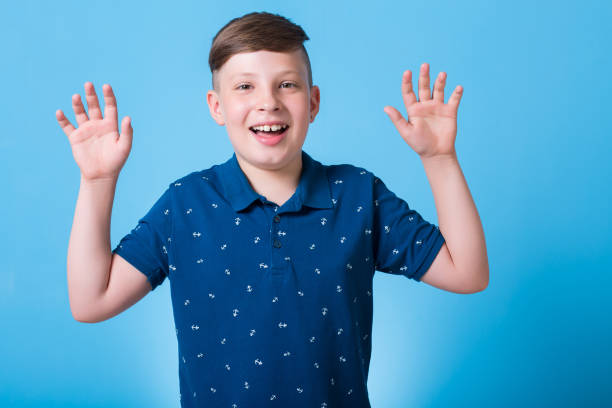 istock emotional boy waving his hands and poin at something 829782440
