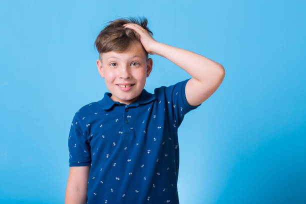 istock emotional boy waving his hands and poin at something 829782484
