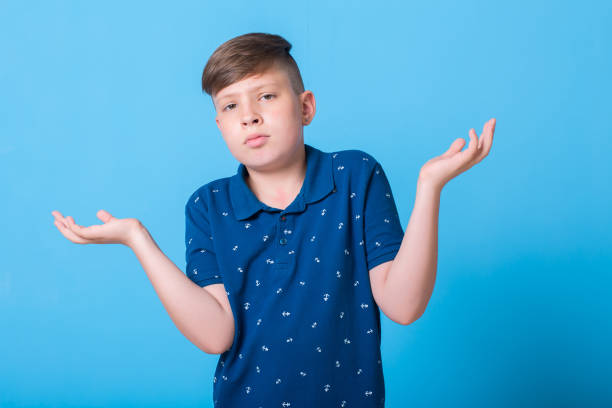 istock emotional boy waving his hands and poin at something 829782768