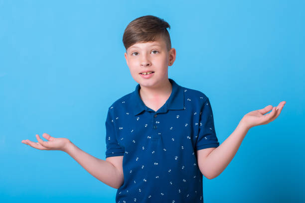 istock emotional boy waving his hands and poin at something 829782772