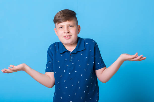 istock emotional boy waving his hands and poin at something 829782782