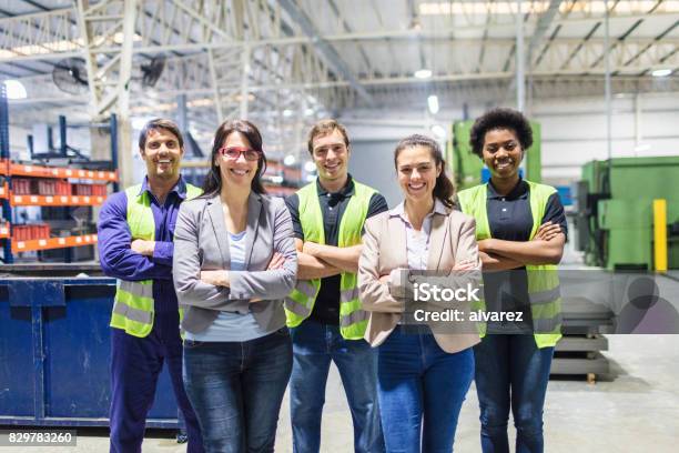 Portrait Of Staff At Distribution Warehouse Stock Photo - Download Image Now - Teamwork, Occupation, Manufacturing