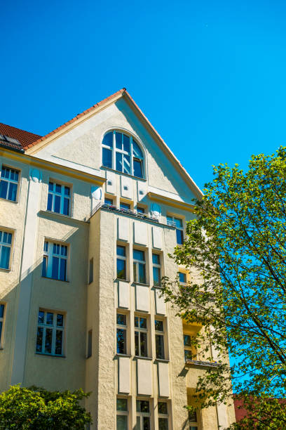 istock yellow facaded house at Berlin in high formatted picture 829793712