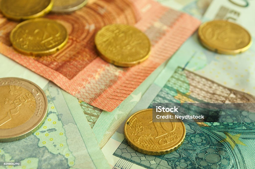 coins and banknote in euro money closeup of coins and banknote in euro money Abstract Stock Photo