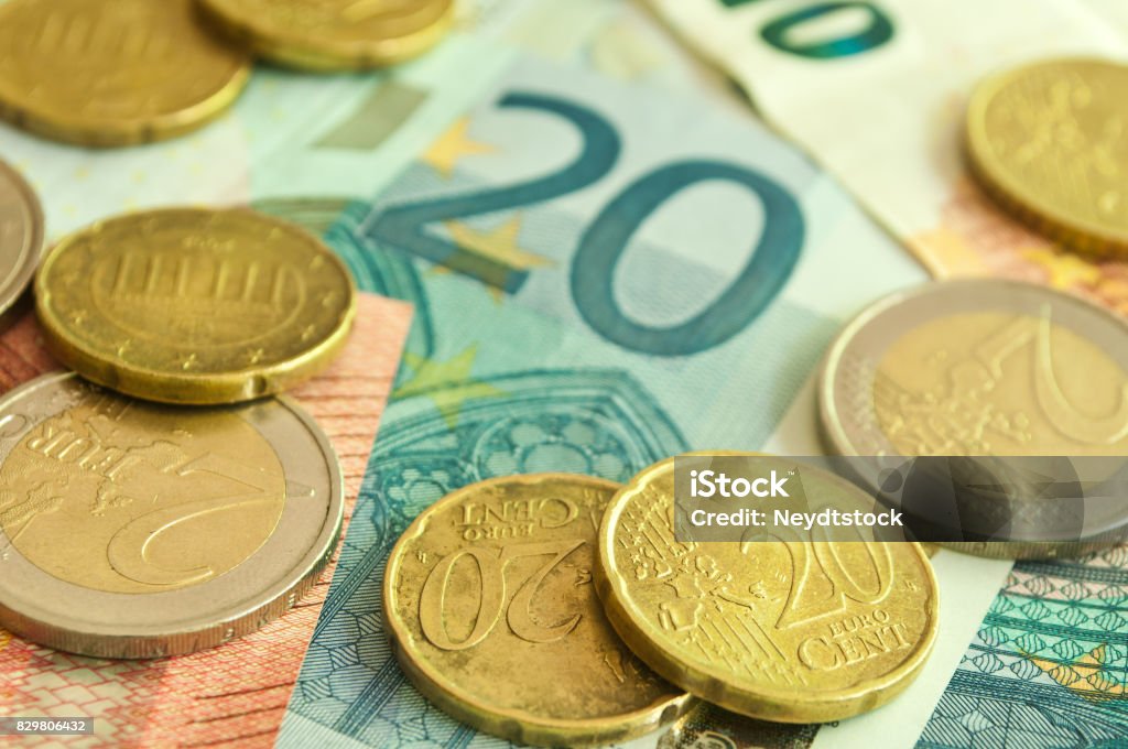 coins and banknote in euro money closeup of coins and banknote in euro money Abstract Stock Photo
