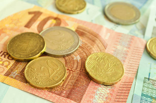 istock coins and banknote in euro money 829806616