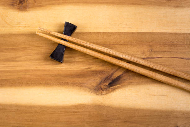istock Wooden chopsticks on board 829808128