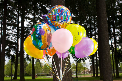 happy birthday balloons in park