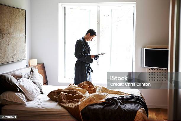 Man In Luxury Bedroom Bathrobe Morning Stock Photo - Download Image Now - Bedroom, Reading, Asian and Indian Ethnicities