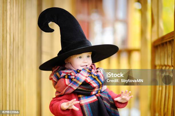 Toddler Boy In Pointed Hat Playing Outdoors Stock Photo - Download Image Now - Wizard, Halloween, Costume
