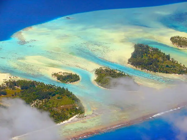 Above Polynesian Tropical Summer paradise: Sandy turquoise tropical beach, Bora Bora, Tahiti motus and reefs aerial view – Idyllic French Polynesia