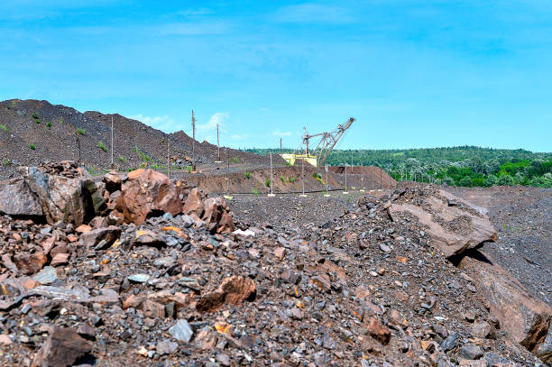 istock Excavator machine at excavation earthmoving work in quarry 829828952