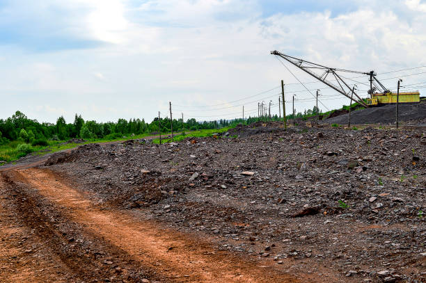 istock Excavator machine at excavation earthmoving work in quarry 829829372
