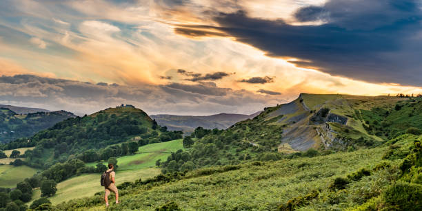 istock Hiker and sunset over Llangollen panorama 829830546