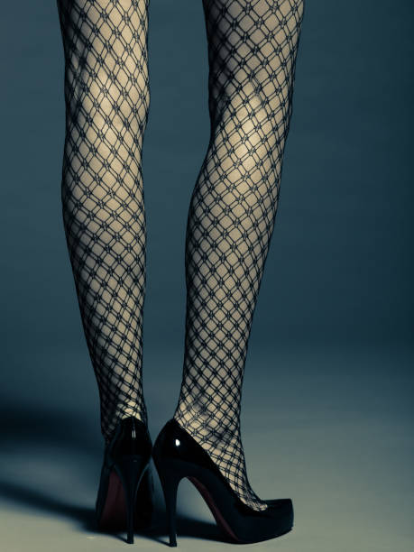 istock Woman's legs in stocking and high heels standing 829861852