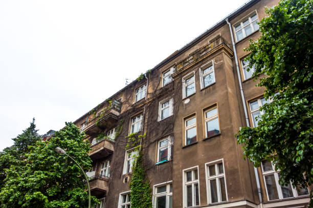 istock brown facade of building with trees and evy 829863872