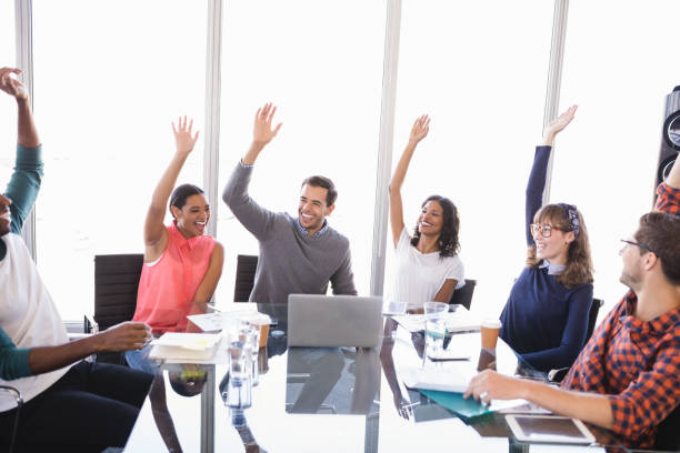 istock Happy business people with arms raised 829876266
