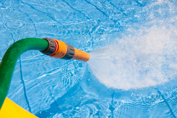 istock filling the plastic swimming pool in sunlight 829891818