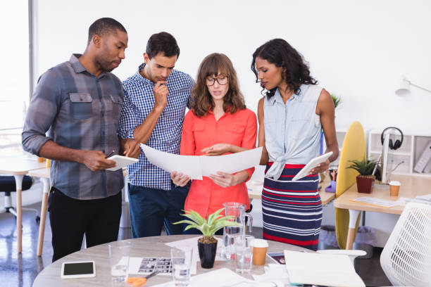 istock Business people discussing over paper 829928824