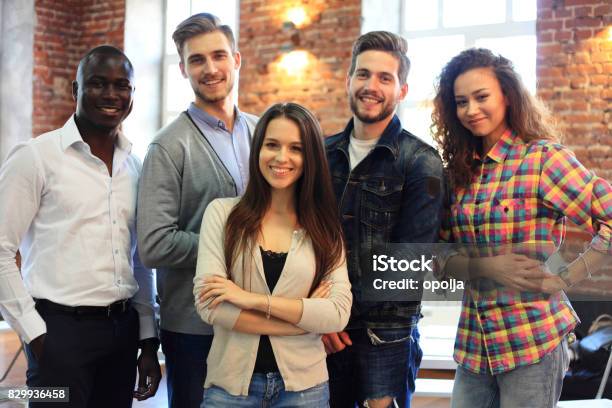 Portrait Of Creative Business Team Standing Together And Laughing Multiracial Business People Together At Startup Stock Photo - Download Image Now