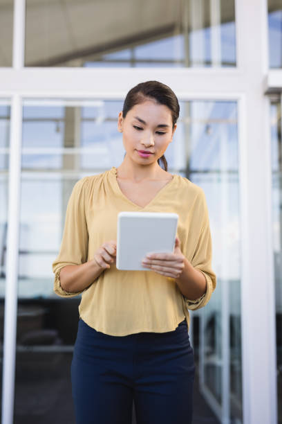 istock Businesswoman using tablet in office 829938630