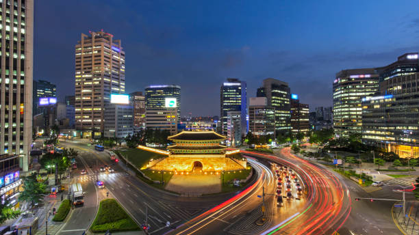 Traffic at old fortress Namdaemun gate in Seoul South Korea.