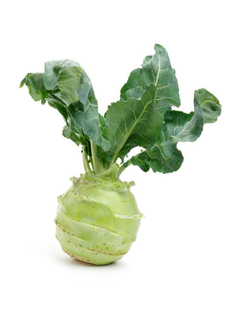 istock Fresh kohlrabi with green leaves  on white background 829968536