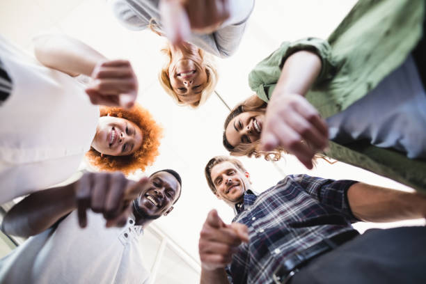 istock Directly below portrait of happy colleagues gesturing 829991154