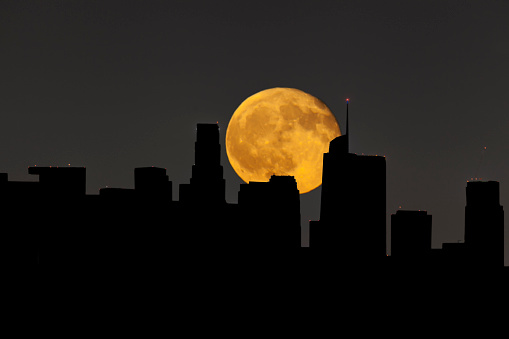 Illustration of Super full moon behind downtown in Los Angeles in August 09 2017
