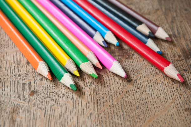 istock colouring pencils on wooden background 830009156