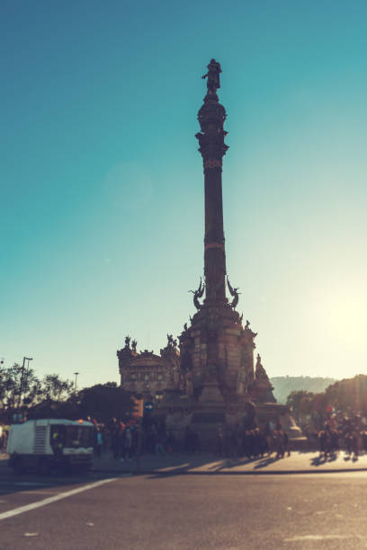 istock columbus monument at barcelona with blurred tourists 830010186