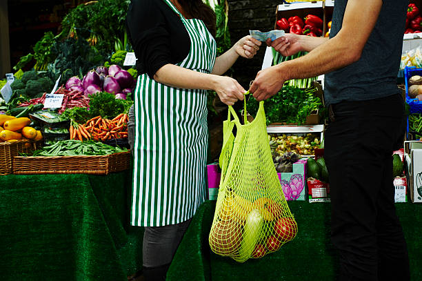 portrait of man buying fresh food at market - vegetable market imagens e fotografias de stock