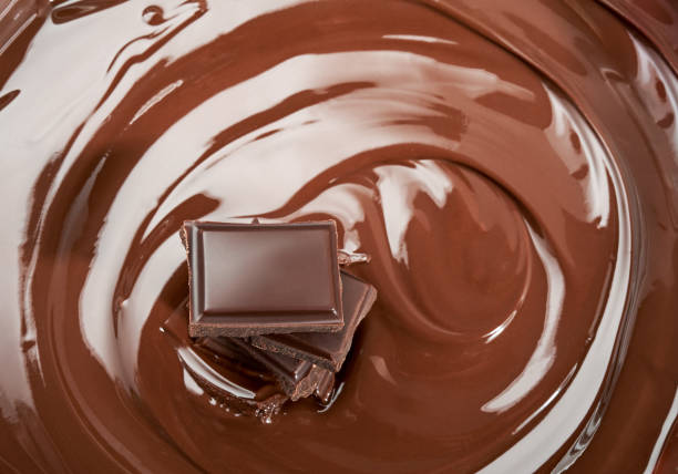 istock Melted pieces of chocolate bar in splash 830016930
