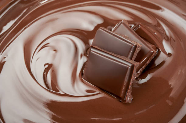 istock Melted pieces of chocolate bar in splash 830016958
