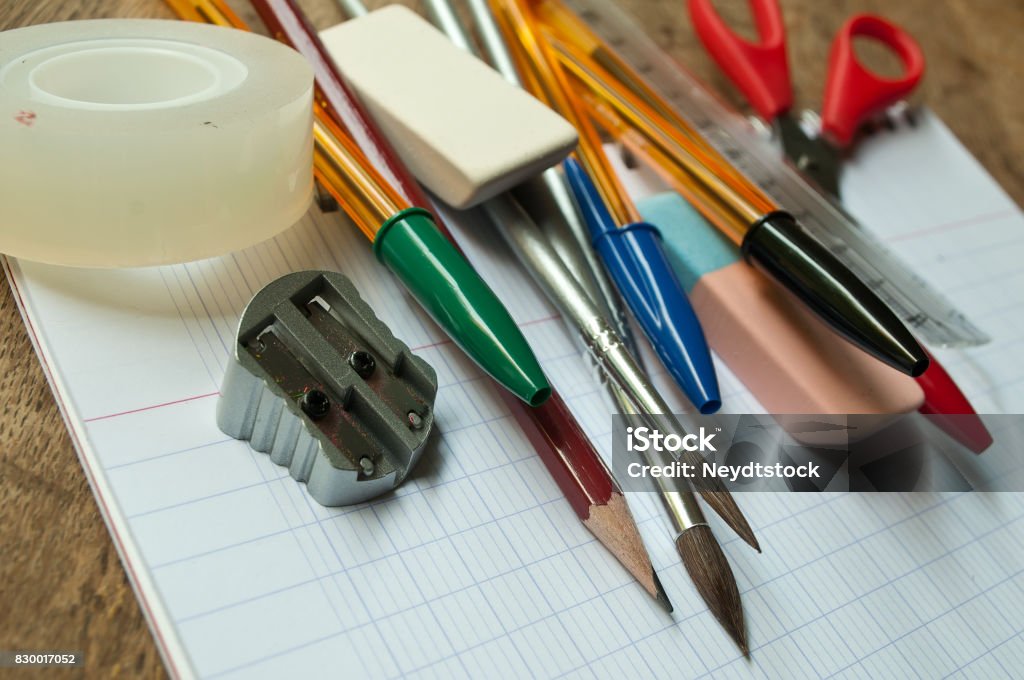 school supplies on notebook closeup of school supplies on wooden desk background Art Stock Photo