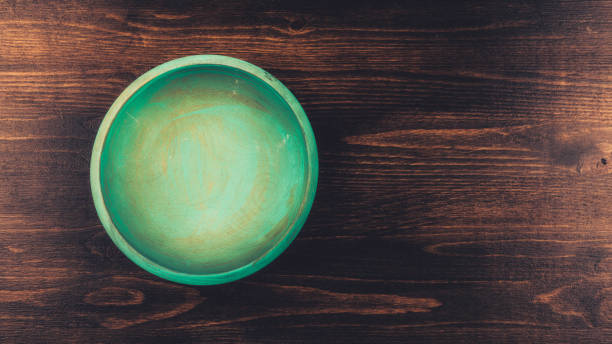 Empty hand painted wooden teal bowl with copy space