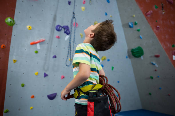 istock Boy standing with rope in fitness studio 830023970