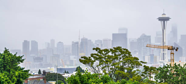 istock cloudy and foggy day with seattle skyline 830028346
