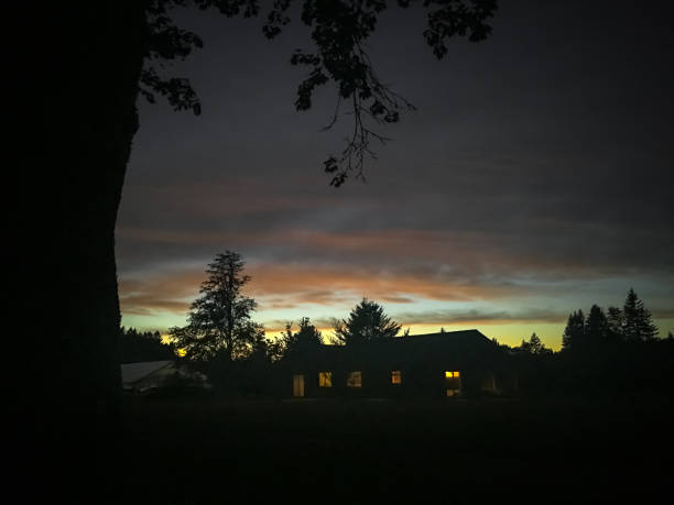 istock Oregon farmhouse and trees at sunset 830047936