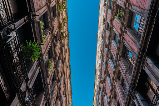 two long brick facaded buildings with clean sky in the middle