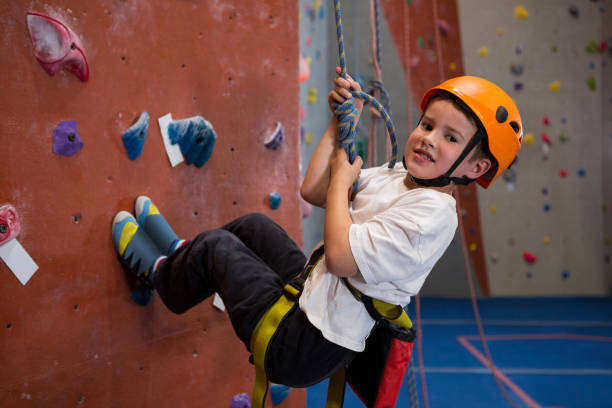 istock Portrait of determined boy practicing rock climbing 830060452