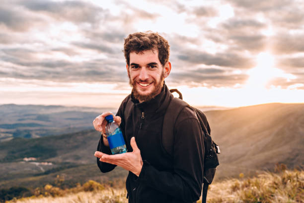 istock Young man with blank water bottle 830066888