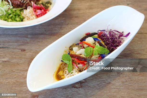 Pomelo Salad Thai Style Mixed With Purple Cabbage Butterfly Pea Torch Ginger Chili And Mint Veganism Food Is The Practice Of Abstaining From The Use Of Animal Products Stock Photo - Download Image Now