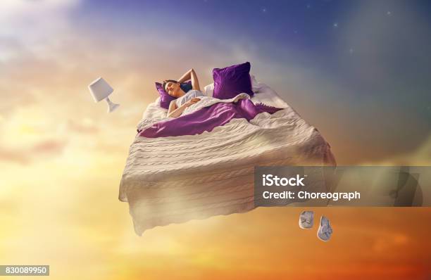 Girl Is Flying In Her Bed Stock Photo - Download Image Now - Dreamlike, Dreaming, Sleeping