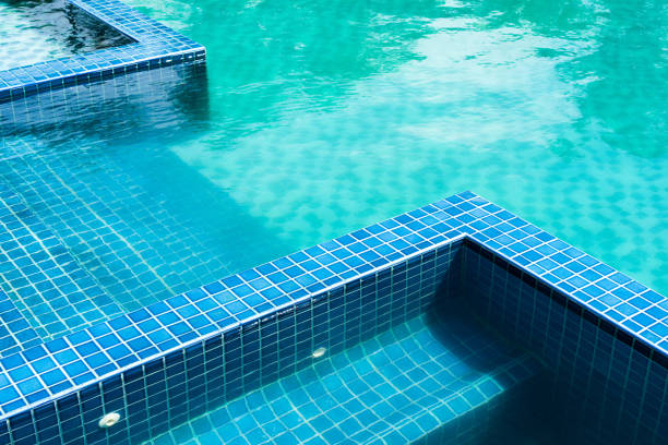 Tranquille swimming pool in spain in the hot time at noon.