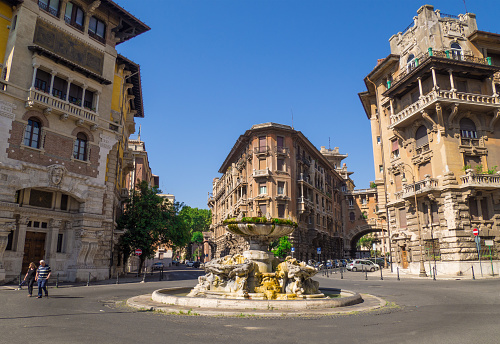 Rome, Italy - 6 August 2017 - The esoteric quarter of Rome, called 'Quartiere Coppedè', designed by architect Gino Coppedè consisting of eighteen palaces, twenty-seven buildings rich in symbologies, a monumental arch and a fountain