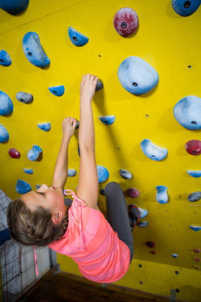 istock Teenage girl practicing rock climbing 830136622