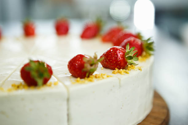 Eat sweet creamy cake with biscuit, white sugar cream & fresh strawberries on topping.Delicious Italian restaurant dessert menu dish.Enjoy strawberry cake for lunch break in cafeteria