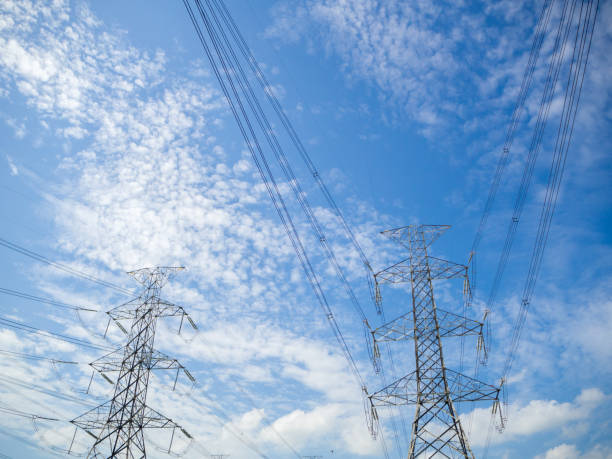 istock Steel electricity pylon on bright blue sky  background. 830164086