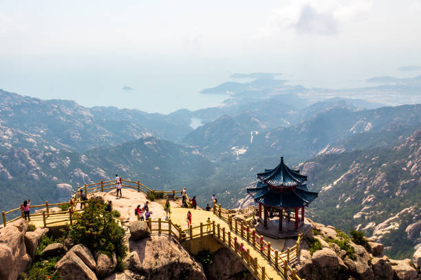 Pavilion on the top of Jufeng trail, Laoshan Mountain, Qingdao, China. Pavilion on the top of Jufeng trail, Laoshan Mountain, Qingdao, China. Jufeng is the highest trail in Laoshan, where visitors can enjoy beautiful aerial views of the landscape qingdao stock pictures, royalty-free photos & images